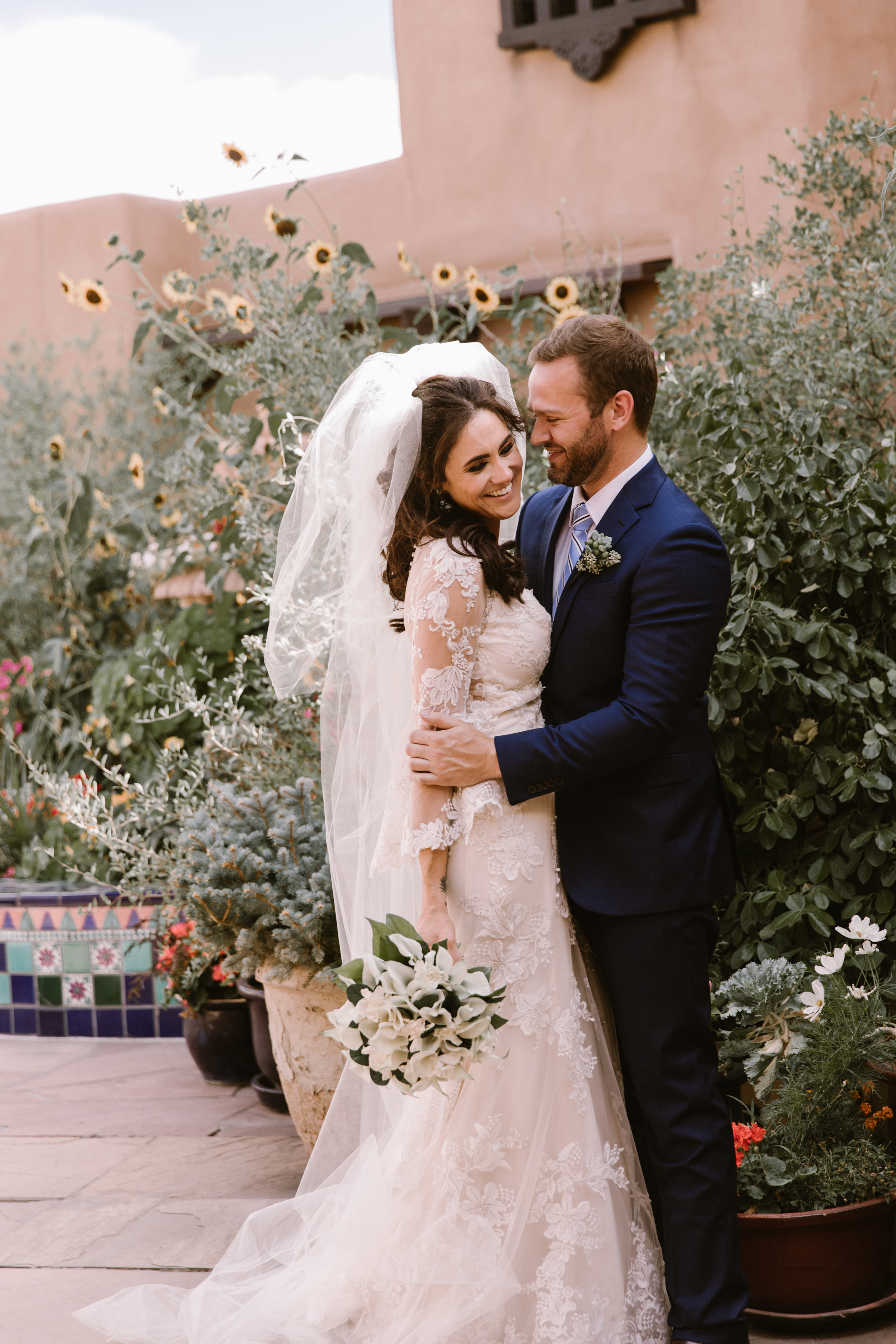 New Mexico wedding Santa Fe planning La Fonda gown suit inspiration design floral bouquet lace photography romantic styled local perfect wedding guide sunflowers first look couple engagement ceremony