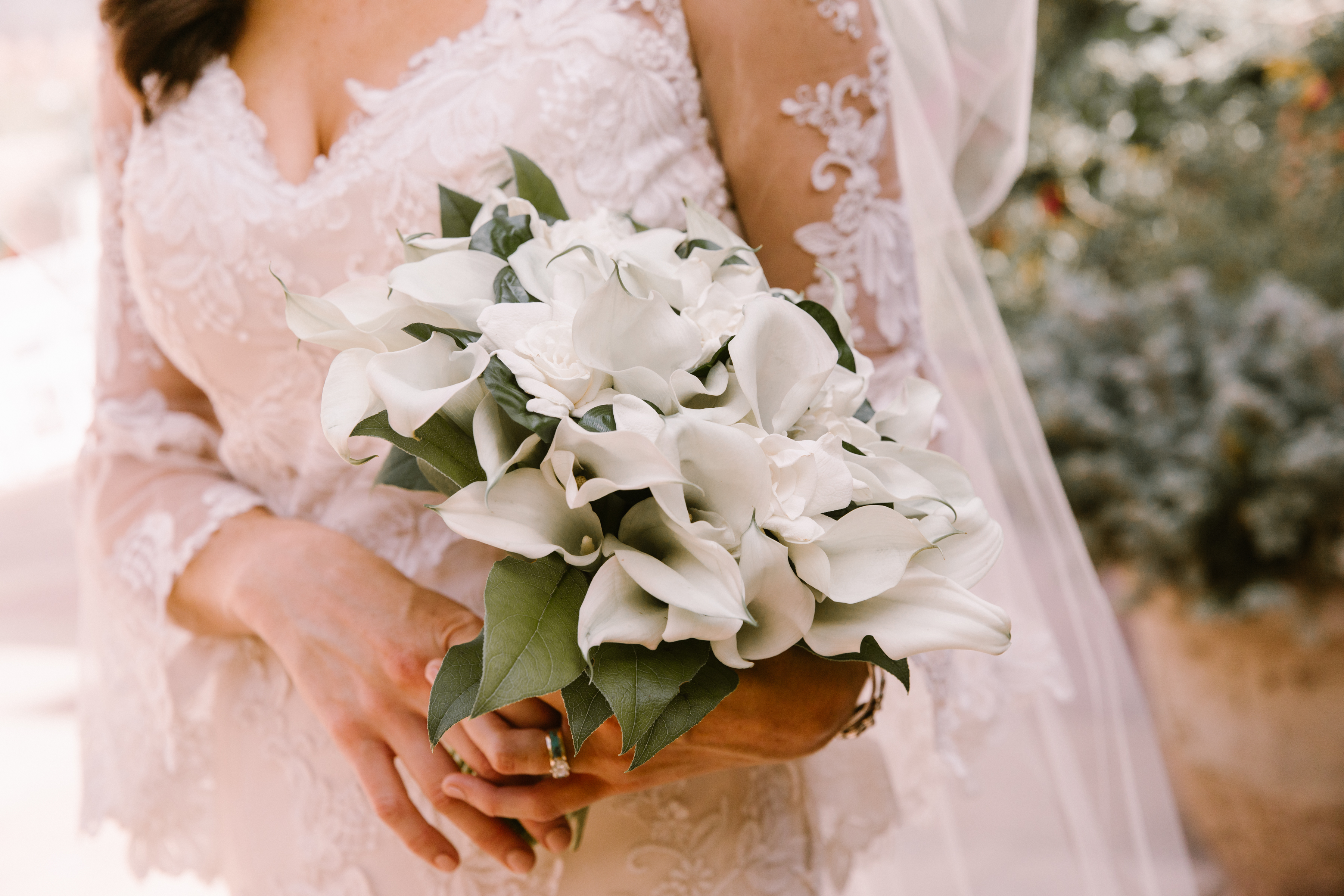 New Mexico wedding Santa Fe planning La Fonda gown suit inspiration design floral bouquet lace photography romantic styled local perfect wedding guide lilies ring sleeves greenery
