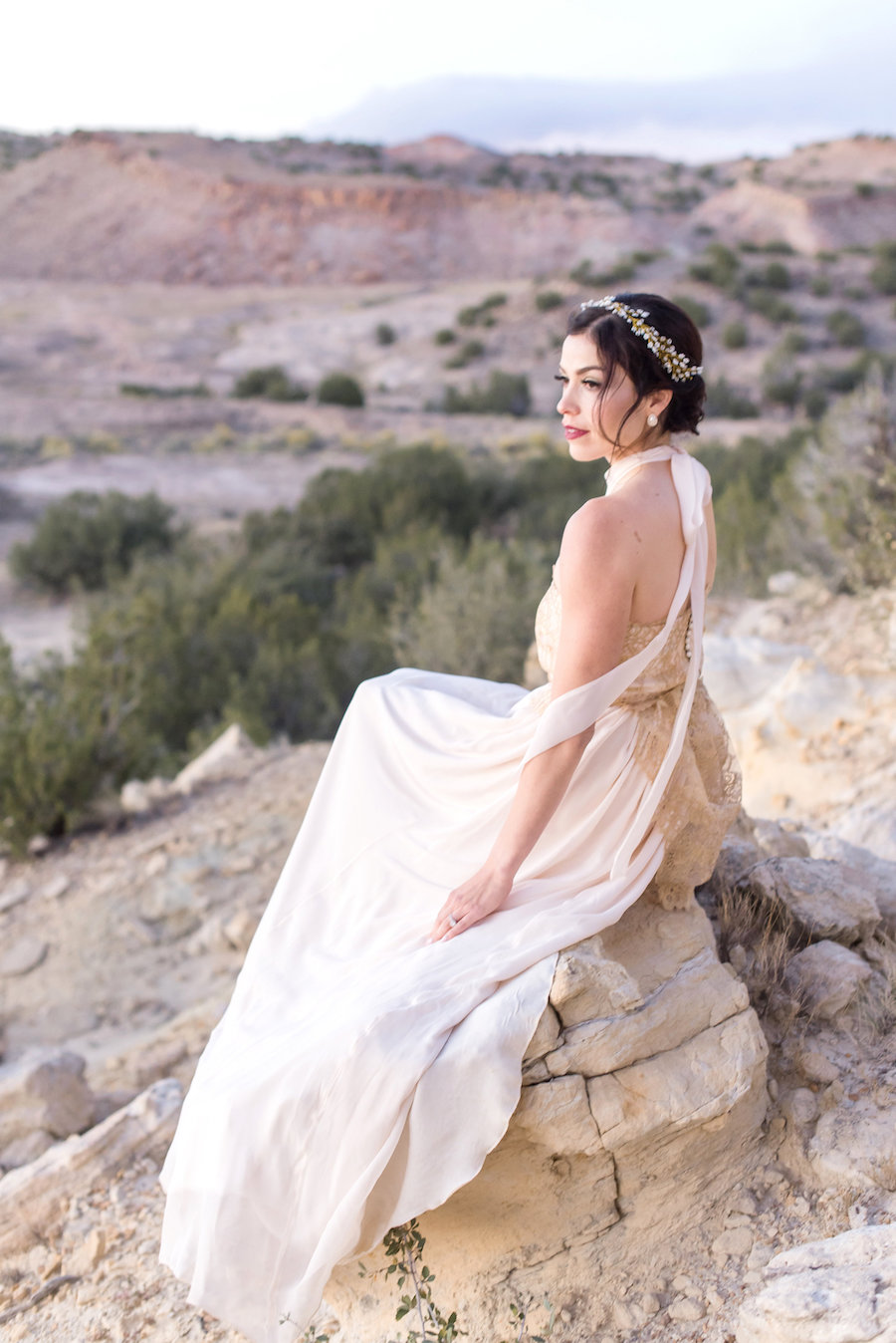 wedding planning photography styled shoot natural light outdoor elopement engagement New Mexico Albuquerque mountains Perfect Wedding Guide gown lace gold dress ribbon high neck hair makeup smoky eye bold lip wedding day hairpiece updo classy elegant love