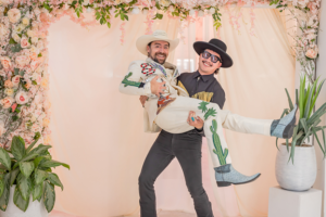 Groom carries groom in celebration